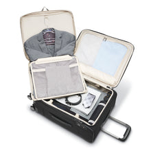 Load image into Gallery viewer, Interior view of the suitcase filled with clothes and the garment bag unfolded and holding a suit.