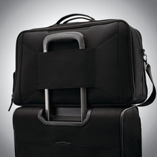 Load image into Gallery viewer, Back panel view with the attachment feature holding the duffle to a suitcase.
