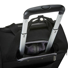 Load image into Gallery viewer, Angled top view of the black spinner suitcase. The telescopic handle can be retracted into a zipper-closing compartment.