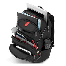 Load image into Gallery viewer, Angled top view of the backpack filled with stationary, electronics and accessories.