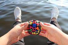 Load image into Gallery viewer, A pair of hands holding the Meffert's ball.