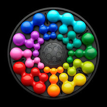 Load image into Gallery viewer, Front view of the game board with the colorful pieces arranged.