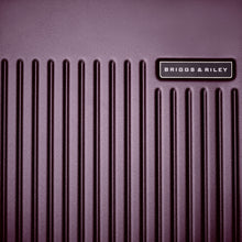 Load image into Gallery viewer, Close up to the front panel. The ridged front panel and Briggs and Riley logo are visible.