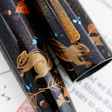 Load image into Gallery viewer, Close up to the chipmunks on the barrel and cap. The left one is holding an acorn.