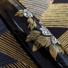 Load image into Gallery viewer, Close up to the maki-e leaves painted on the flower.
