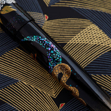 Load image into Gallery viewer, Close up to the blue abalone shell (raden) on the barrel.