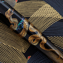 Load image into Gallery viewer, Close up to the intricate golden snake design on the barrel