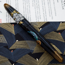 Load image into Gallery viewer, Side view of the foutnain pen showing a part of the raden and egg shell (rankaku) decorations. The cap is placed on.
