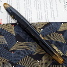Load image into Gallery viewer, Side view of the fountain pen with the cap on.