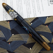 Load image into Gallery viewer, Side view of the fountain pen with the cap on.