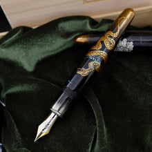 Load image into Gallery viewer, The fountain pen with the cap set behind it.