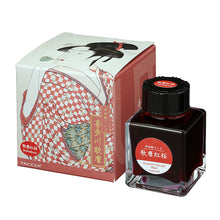 Load image into Gallery viewer, Taccia Utamaro Benizakura ink bottle and packaging with Japanese woodblock print designs on a white background. The ink is a vibrant red color.