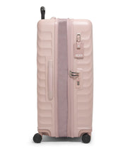 Load image into Gallery viewer, Side panel view of the mauve suitcase, showing the side handle, TSA lock, and ID card.