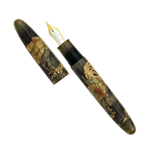Load image into Gallery viewer, A fountain pen with a matching cap, featuring a detailed rooster illustration in gold and red over a dark textured background, with a gold-toned nib visible.
