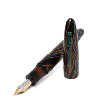 Load image into Gallery viewer, Angled view of the fountain pen with the cap set to the side.