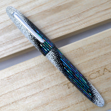 Load image into Gallery viewer, Front view of the fountain pen on top of the presentation box and lid