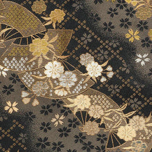 Load image into Gallery viewer, Close up to the Sakura Night kimono case fabric. It features a black fabric with light gray colors, a diamond pattern, and sakura flowers with fans.