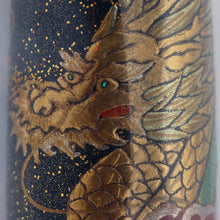 Load image into Gallery viewer, Close up to the dragon's face. The eyes are made with two small blue abalone shell pieces.