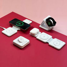 Load image into Gallery viewer, The charging station folded in different angles while charging a phone, smart watch, and earbuds case.