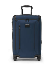 Load image into Gallery viewer, Front panel view of the blue suitcase with black accents. The telescopic handle is partly extended.