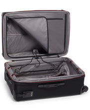 Load image into Gallery viewer, Interior view of the black suitcase with the front panel divider unzipped.