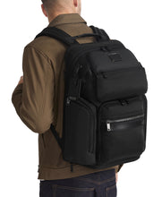 Load image into Gallery viewer, A young man carrying the backpack.