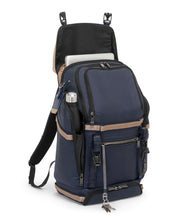 Load image into Gallery viewer, Angled front panel with the flap lifted and a laptop peeking from the back compartment.