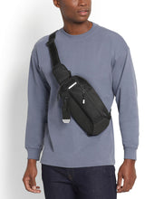 Load image into Gallery viewer, A young man with a gray sweatshirt wearing the sling bag across his chest.