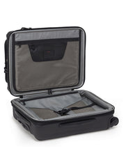 Load image into Gallery viewer, The suitcase laid on its back with the main compartment opened. It features organizational panels.