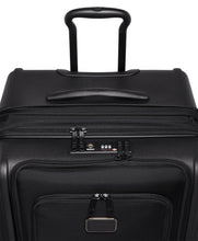 Load image into Gallery viewer, Angled view of the suitcase's top panel. It features a grab handle, and a TSA approved three-digit combination lock.