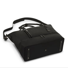 Load image into Gallery viewer, Angled view of the bag laid on the back panel. The bottom panel has five stubs at the bottom to clean the bag clean.