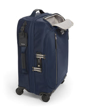 Load image into Gallery viewer, Angled side panel view of the suitcase with the front pocket unzipped. The side panel has a grab handle, a TSA approved three-digit combination lock.