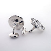 Load image into Gallery viewer, The silver cufflinks on a light gray background