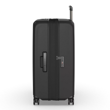 Load image into Gallery viewer, Side panel view of the suitcase. Shown with the expandable feature extended.