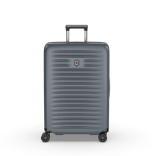 Load image into Gallery viewer, Front panel view of the hard shell suitcase with the telescopic handle partly extended.