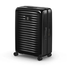 Load image into Gallery viewer, Angled front panel view of the black hard sided suitcase with the telescopic handle retracted.