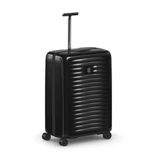 Load image into Gallery viewer, Angled front view of the black hard side case with the telescopic handle partly extended.