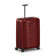 Load image into Gallery viewer, Angled front view of the red hard side suitcase with the telescopic handle extended.