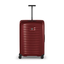 Load image into Gallery viewer, Front panel view of the red hard side suitcase with the telescopic handle partly extended.