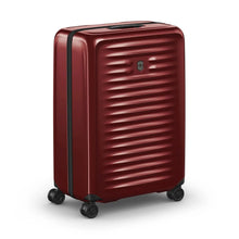 Load image into Gallery viewer, Angled front panel view of the red hard side suitcase with the telescopic handle retracted.