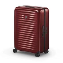 Load image into Gallery viewer, Angled front view of the red hard side suitcase with the telescopic handle retracted.