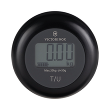 Load image into Gallery viewer, Frotn view of the scale with the following printed: The Victorinox logo, Max.35kg, d=50g, T/U