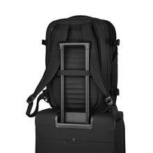 Load image into Gallery viewer, Back panel view with a suitcase's telescopic handle tied to the backpack's attachment strap.
