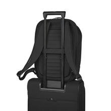 Load image into Gallery viewer, The back panel's attachment strap, passed through the telescopic handle of a suitcase to hold it in place.