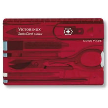 Load image into Gallery viewer, Close up to the Swiss card with the tools arranged inside.