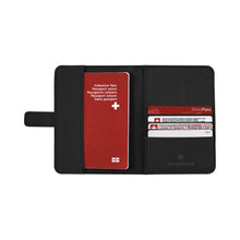 Load image into Gallery viewer, Opened view of the black passport holder. The left side holds your passport. The right side can hold up to four credit cards or IDs.