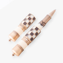 Load image into Gallery viewer, The Checkmate Rollerball Pen is shown with the cap set on the side. The word "CHECKMATE" is featured on the cap, along with the letters for each column and row.