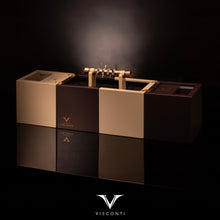 Load image into Gallery viewer, The Visconti Checkmate is set on the display box with some chess pieces.