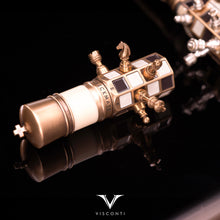 Load image into Gallery viewer, The Visconti Checkmate's pen cap is part of the magnetic chessboard. The image features it with five pieces attached to it.