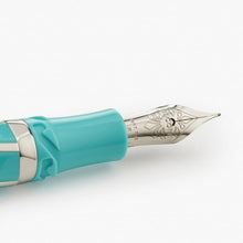 Load image into Gallery viewer, Close up to the clip of the Visconti Divina Elegance Wave Fountain Pen.  It has an engraving with decorations, the word VISCONTI, 18KT 750 Gold, and F for a Fine point.